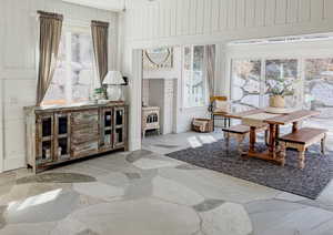 Sitting room with wooden walls and stone flooring