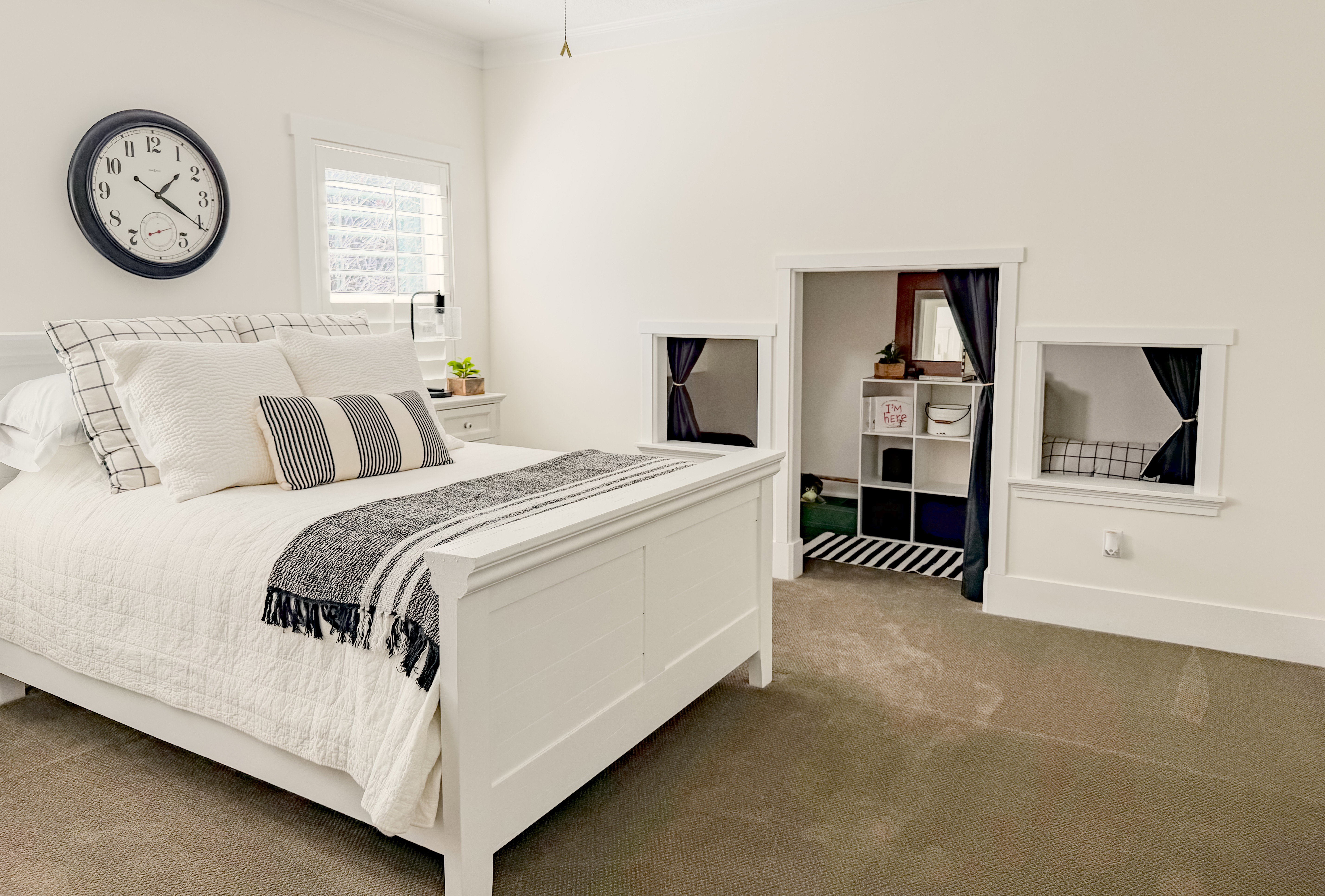Carpeted bedroom with ornamental molding and baseboards