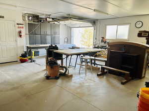 Garage with a heating unit and a workshop area