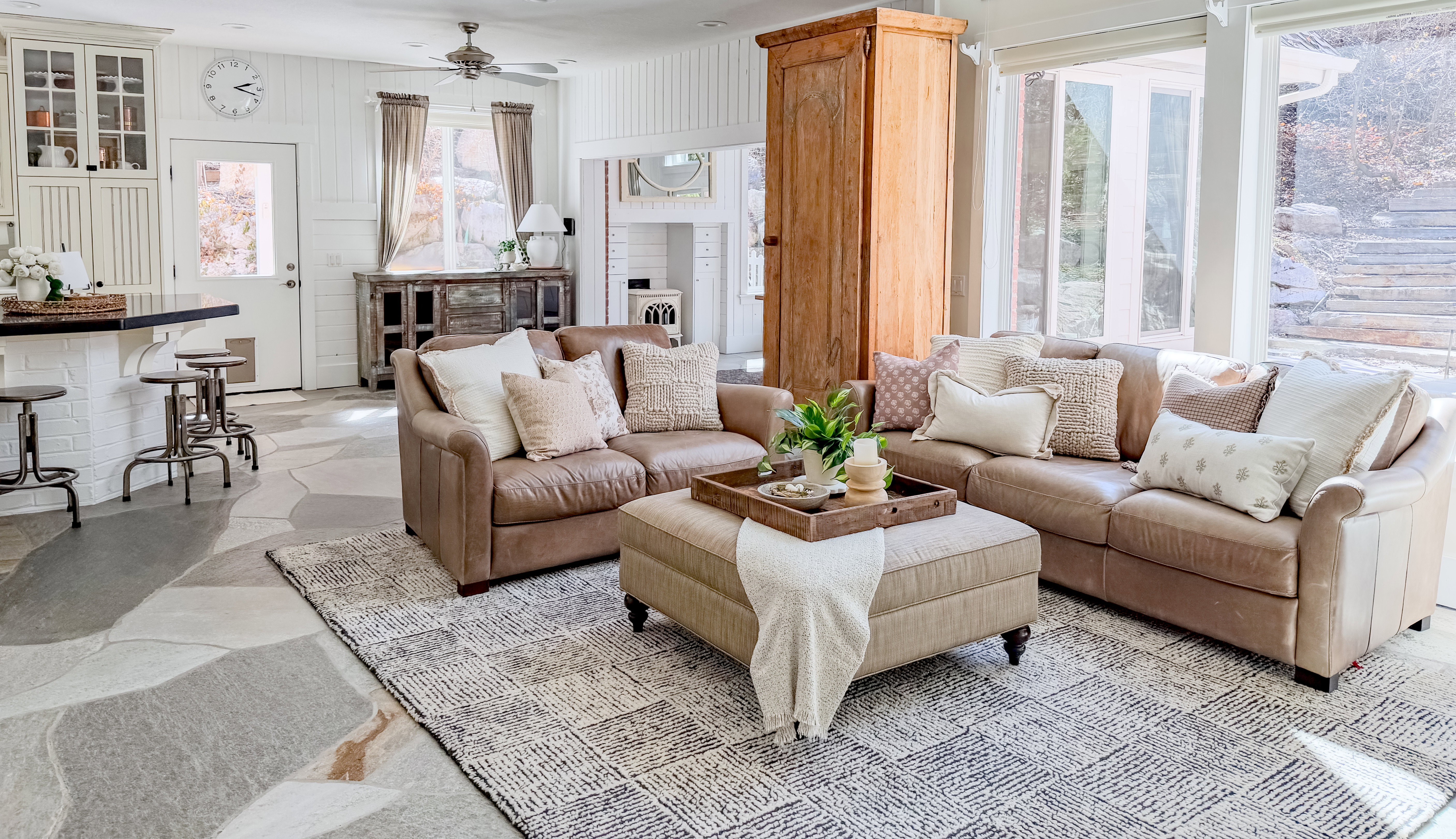 Living room with stone floors and ceiling fan