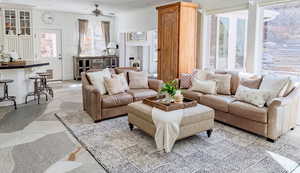 Living room with stone floors and ceiling fan
