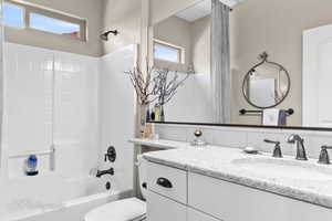 Full bathroom with vanity and shower / tub combination