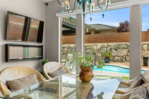 Sunroom with a chandelier