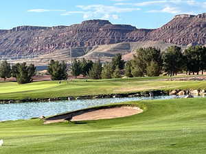 View of community with a water and mountain view and golf course view
