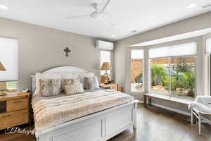 Bedroom featuring multiple windows, ceiling fan, dark wood-type flooring, and recessed lighting