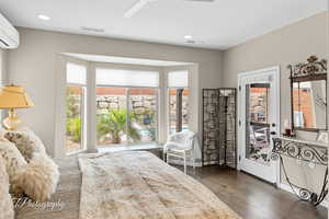 Bedroom featuring dark wood-style floors, ceiling fan, access to outside, and recessed lighting