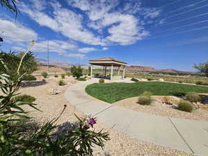 Surrounding community with a patio and a mountain view