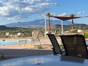 Community pool featuring a mountain view