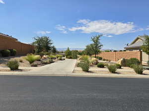 View of asphalt street featuring curbs