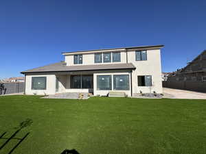 Back of house with a patio area, stucco siding, and a tile roof