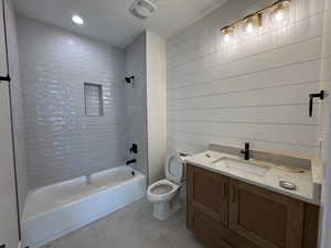 Full bath with vanity, bathing tub / shower combination, recessed lighting, and light tile patterned flooring