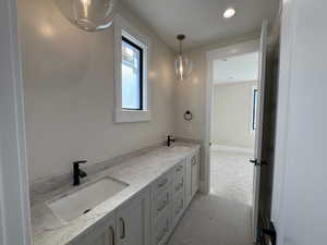 Bathroom featuring double vanity and recessed lighting
