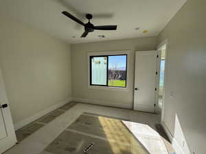 Unfurnished bedroom with ceiling fan and baseboards