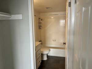 Bathroom featuring vanity and  shower combination