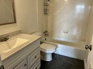 Bathroom with vanity and bathing tub / shower combination