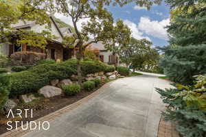 View of front of home with stone siding and stucco siding