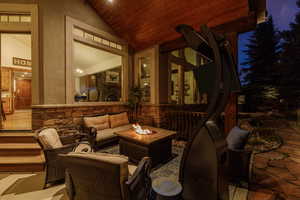 View of patio / terrace featuring an outdoor living space with a fire pit