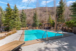 Outdoor pool featuring a patio area and a gazebo