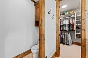 Bathroom with toilet and a spacious closet