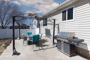 View of patio / terrace featuring grilling area and outdoor dining area