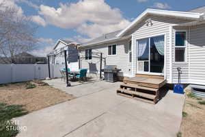 View of patio featuring area for grilling and outdoor dining space