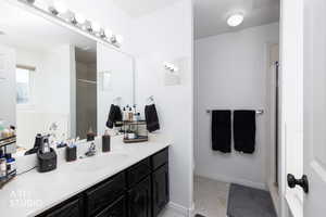Primary Ensuite. Full bathroom with a stall shower, bath tub, vanity, and light tile patterned floors