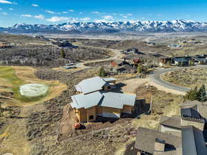 Aerial view of property and surrounding area with mountains, ski area views