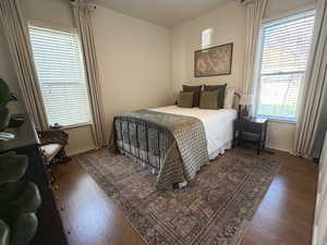 Main floor bedroom with hardwood floors