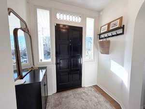 Foyer with original windows above door