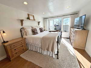 Primary bedroom with original brass hardware and private deck.  A mini split in the bedroom allows for custom temperature control