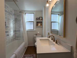 Bathroom with marble surround and refinished original cast iron tub