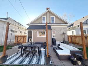 Rear view of home and back patio