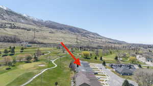 Bird's eye view of mountains and a golf course.