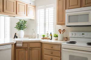 Formica countertops, original cabinets. Coil stove.