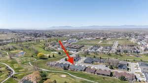 Aerial view of Eagle Crest featuring a mountainous background and a golf course