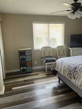Bedroom 2 with multiple windows, a ceiling fan, a textured ceiling, and a closet