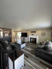 Living area featuring a fireplace and wood finished floors