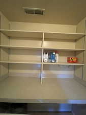 Laundry room with Storage shelves and folding table