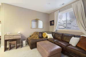 Living room featuring carpet and baseboards