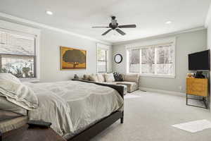Bedroom featuring carpet flooring, ornamental molding, and ceiling fan