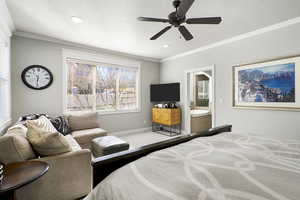 Carpeted bedroom with ornamental molding, a ceiling fan, connected bathroom, a textured ceiling, and recessed lighting