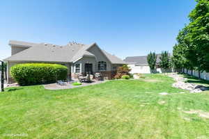 Last Summer - Back of house featuring a patio area, stone siding, and stucco siding