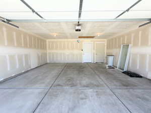 Garage featuring a garage door opener