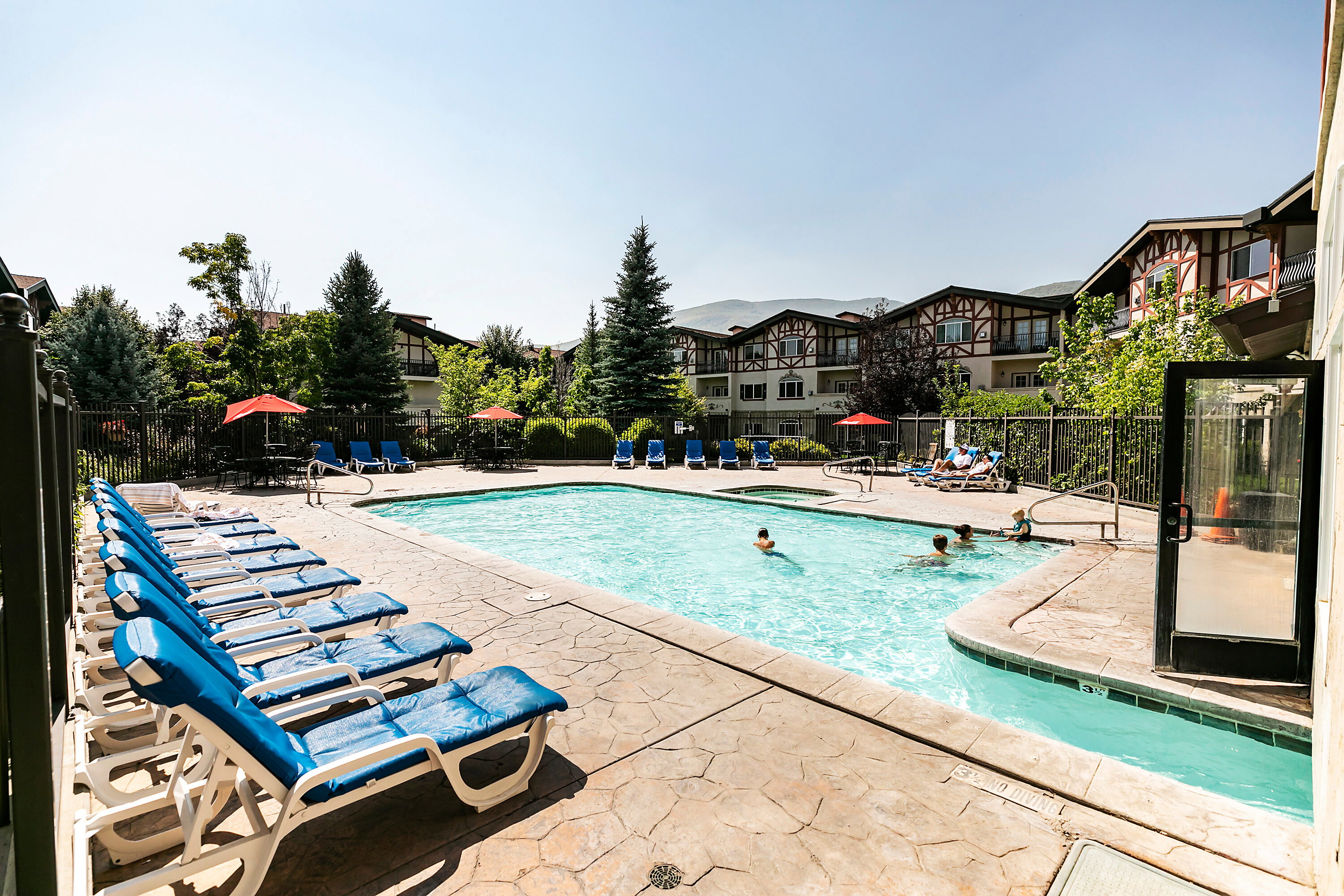 Community pool with a patio