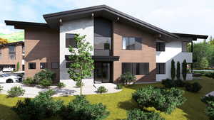 Back of property featuring stone siding and a lawn