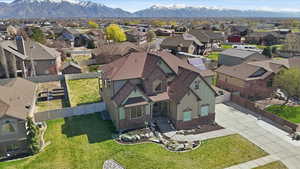 Aerial view of residential area featuring a mountain backdrop