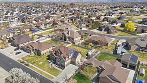 Aerial view of property's location with nearby suburban area