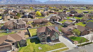 Aerial perspective of suburban area featuring a mountainous background