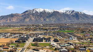 View of mountain backdrop featuring nearby suburban area