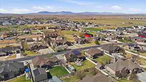 Aerial view of property's location with nearby suburban area